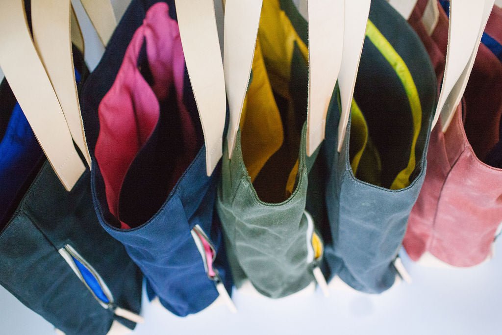 The Notebooks & Honey Collection sells the ultimate modern tote bag.  These waxed canvas carryall totes come in five colors.